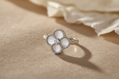 Clover ring on linen with warm beige tones